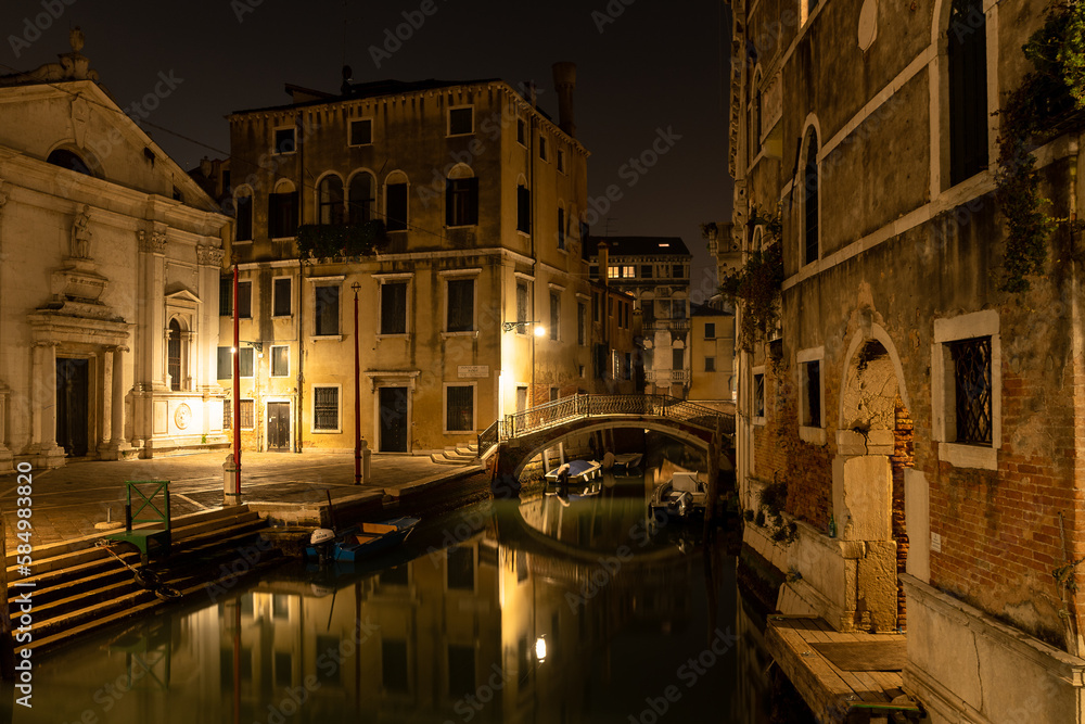 Venice canal view at night with bridge