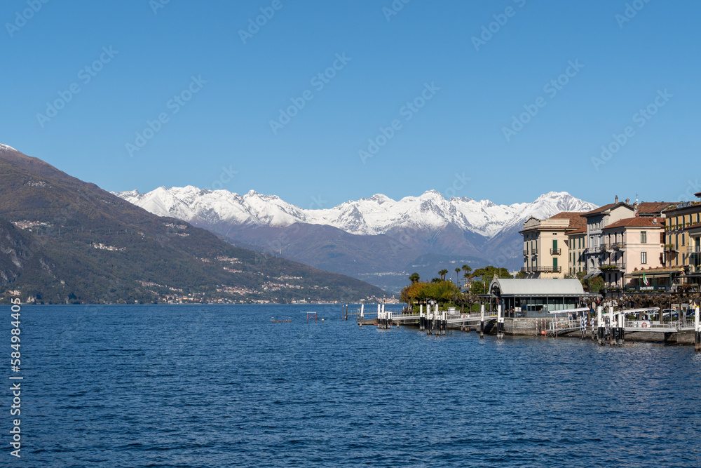 scenic view of the port of menaggio with the snowy mountains