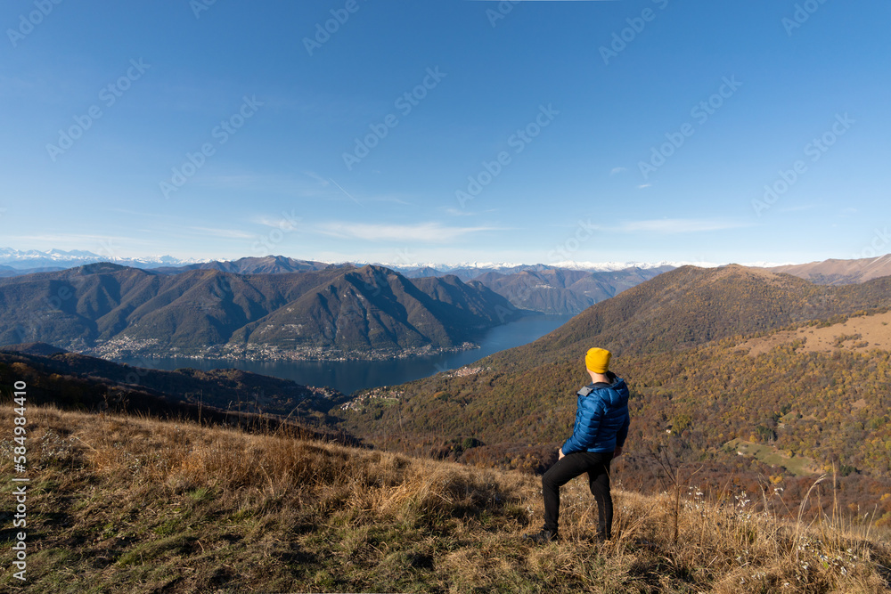 traveler man admiring landscape of lake di como italy
