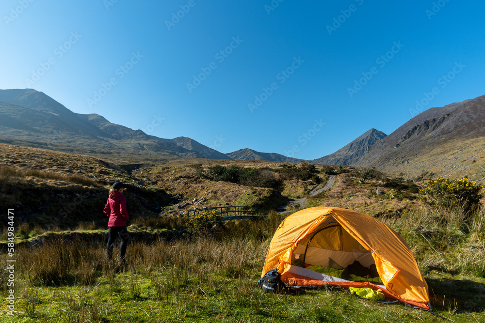 traveler woman in camping enjoying mountain landscape