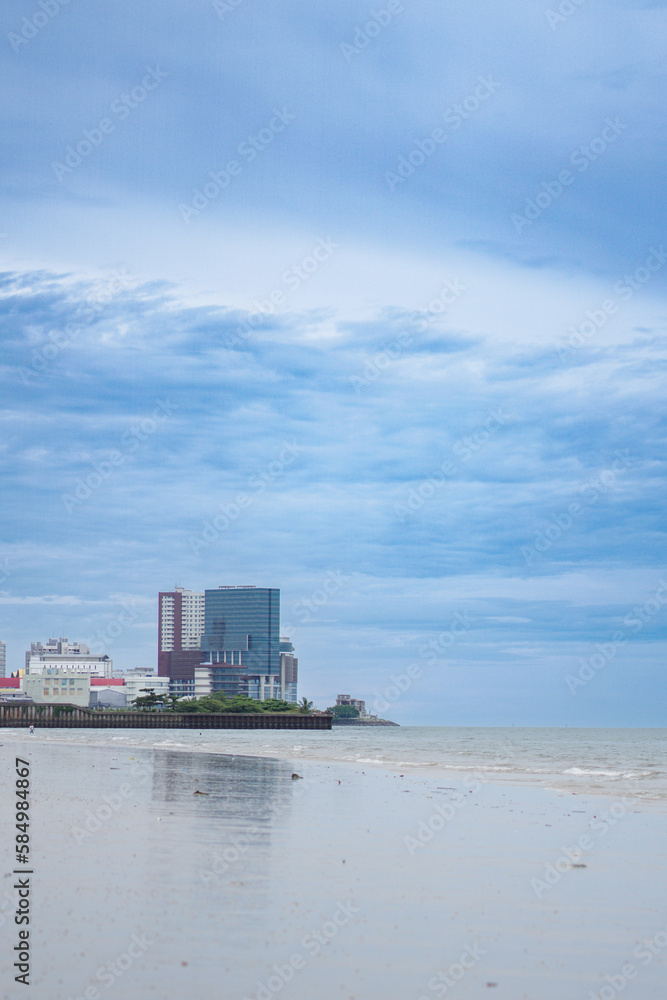 the buildings in the city of balikpapan seen from the beach the buildings in the city of balikpapan seen from the beach