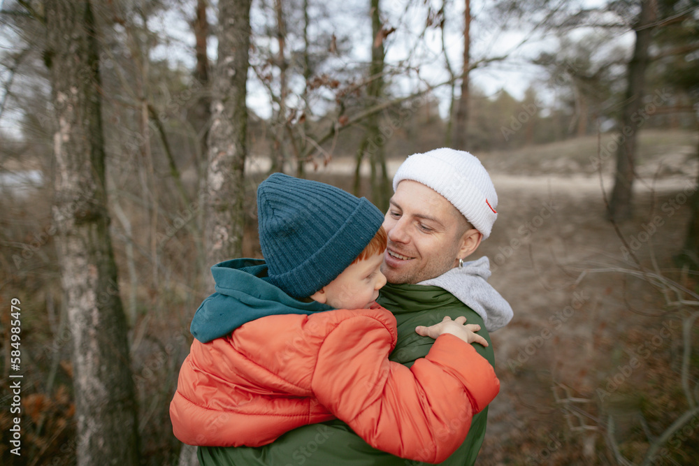 
father and son near the lake