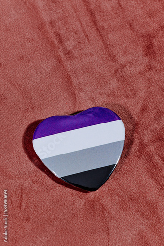 heart-shaped badge patterned with an asexual pride flag photo