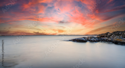 Coastal scene with sunset clouds  Sweden.