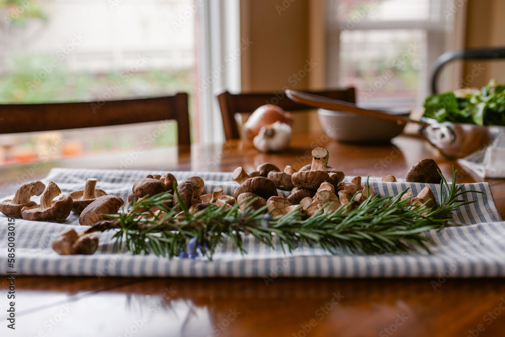 Rosemary and mushrooms to prepare recipe tabletop Stock Photo | Adobe Stock