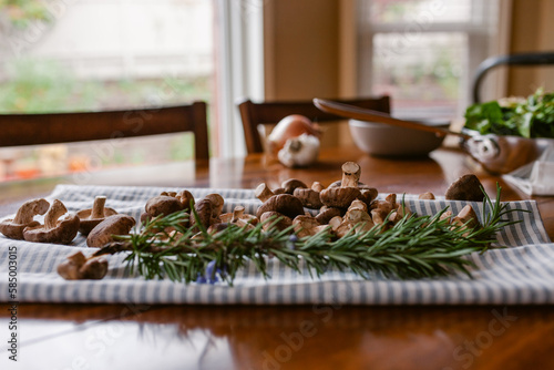 Rosemary and mushrooms to prepare recipe tabletop