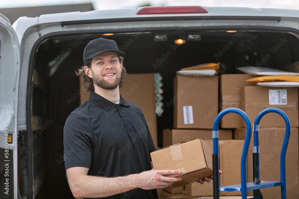 Shipment: Smiling Delivery Man Puts Boxes On Dolly Shipment: Smiling Delivery Man Puts Boxes On Dolly
