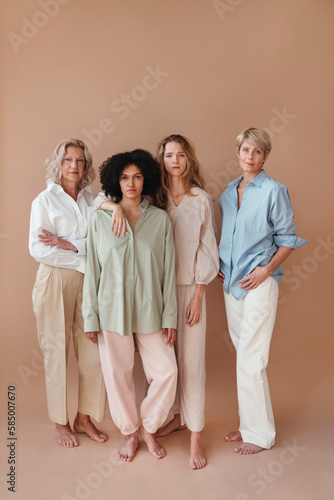 Portrait of four women supporting each other.