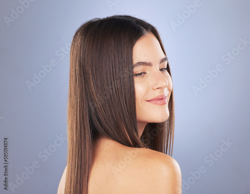 Woman, beauty and hair care smile in studio for texture, growth and healthy shine on blue background. Aesthetic female model face for haircare, self love and cosmetics for salon or hairdresser mockup