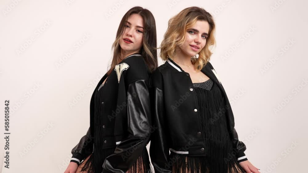 Two young women doing body wave, dancing back to back. High quality 4k footage Two young women doing body wave, dancing back to back. High quality 4k footage