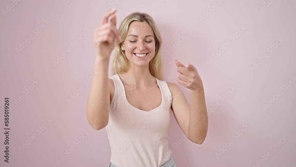 Young blonde woman smiling confident pointing to camera over isolated pink background Young blonde woman smiling confident pointing to camera over isolated pink background