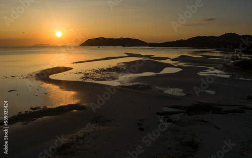 Thong Krut sandbanks and low tide in golden sunset light and ocean - Koh Samui island in Thailand