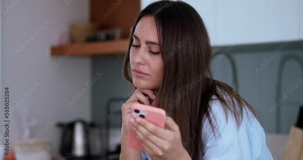 woman holds the phone and doubt stage to answer call concept of the relationship between man and woman doubt stage in relationship. brunette woman does not want to answer call or sms she doubt stage