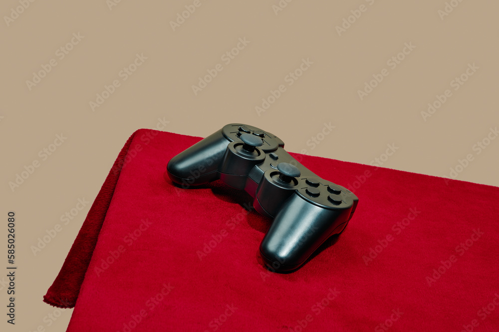 © Juan Moyano/Stocksy - game controller on a table © Juan Moyano/Stocksy - game controller on a table