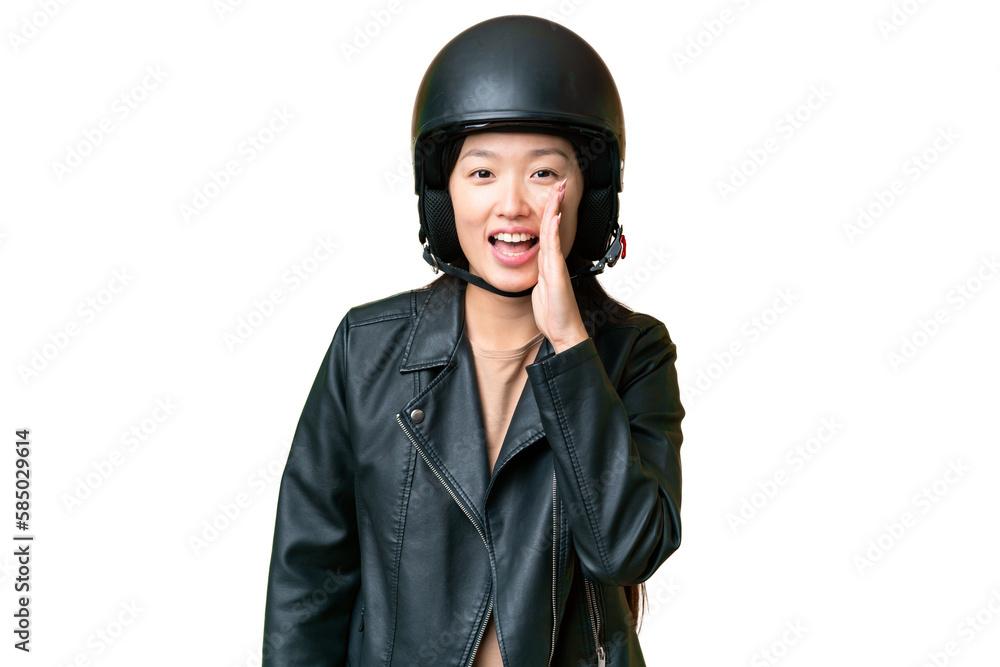 Young Asian woman with a motorcycle helmet over isolated chroma key background shouting with mouth wide open Young Asian woman with a motorcycle helmet over isolated chroma key background shouting with mouth wide open