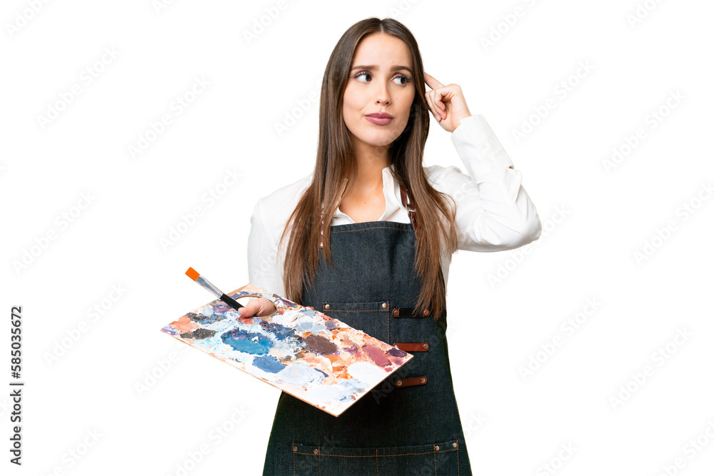 Young artist woman holding a palette over isolated chroma key background having doubts and thinking Young artist woman holding a palette over isolated chroma key background having doubts and thinking