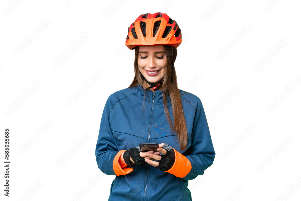 Young cyclist woman over isolated chroma key background sending a message with the mobile - obrazy, fototapety, plakaty 