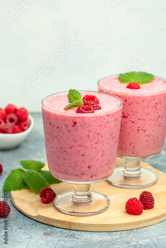 raspberry dessert in glass jar with berries. Yogurt cocktail on a white background. place for text, top view