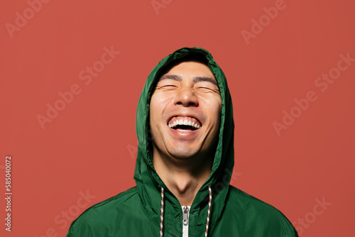 Funny man on vibrant red background photo