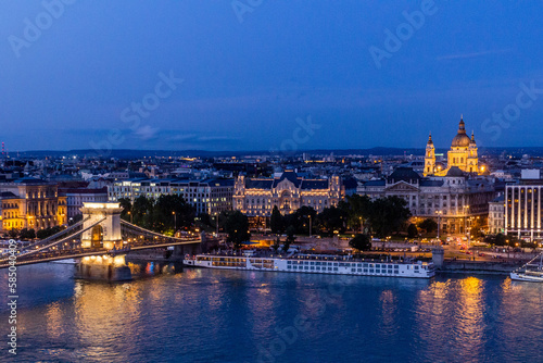 Evening view of St. Stephen s Basilica and Szechenyi Lanchid bridge in Budapest  Hungary