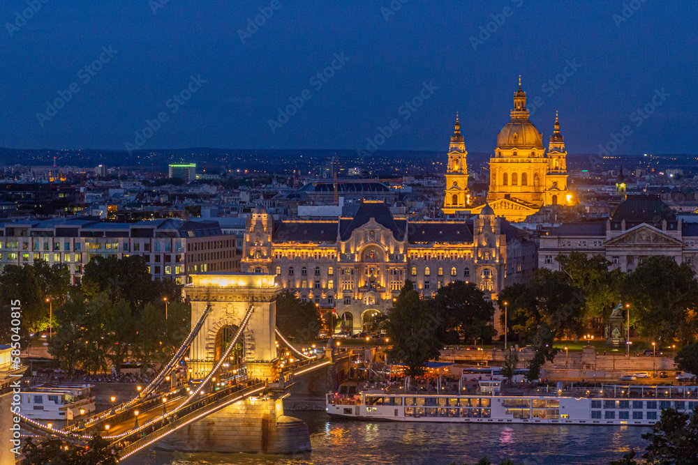 Evening view of St. Stephen's Basilica and Szechenyi Lanchid bridge in Budapest, Hungary