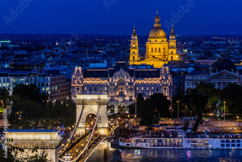 Evening view of St. Stephen's Basilica and Szechenyi Lanchid bridge in Budapest, Hungary