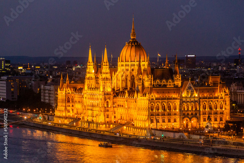 Evening view of Danube river and Hungarian Parliament Building in Budapest, Hungary © Matyas Rehak