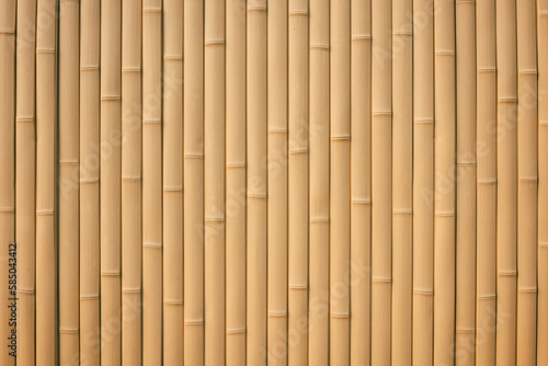 Texture of a light brown bamboo wall. Bamboo sticks background