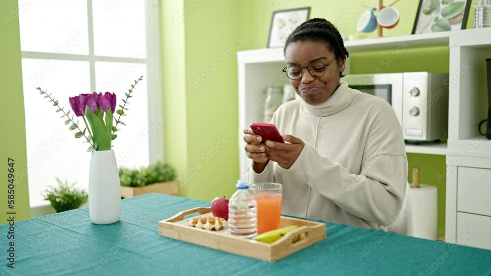 African american woman taking picture to breakfast at dinning room African american woman taking picture to breakfast at dinning room