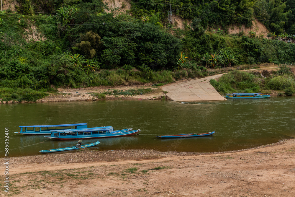 Boats at Nam Ou river in Muang Khua town, Laos