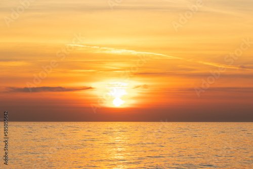 sunset on the sea, seascape, the sun sets behind the clouds © yta