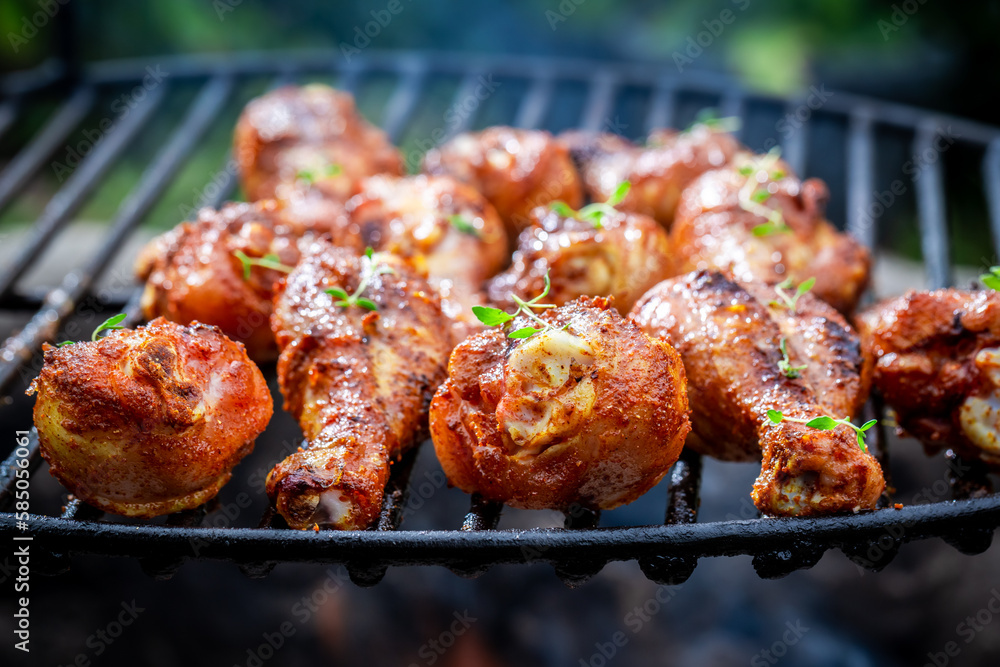 Hot grilled chicken leg with herbs and spicy spices.
