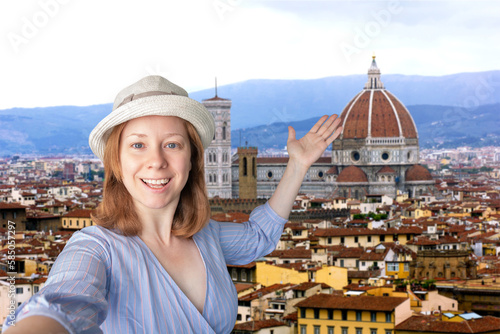tourist takes a selfie with landmarks, italian travel, tourist international trip,tourism and travel, happy woman in a hat is photographed against the background of florence in Italy,