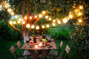 Preparation for supper with wine in the summer evening