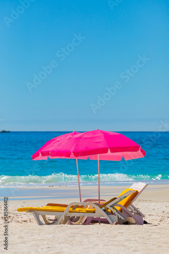 Fototapeta Naklejka Na Ścianę i Meble -  Lounger chairs and parasol umbrellas on sandy beach in Cape Town