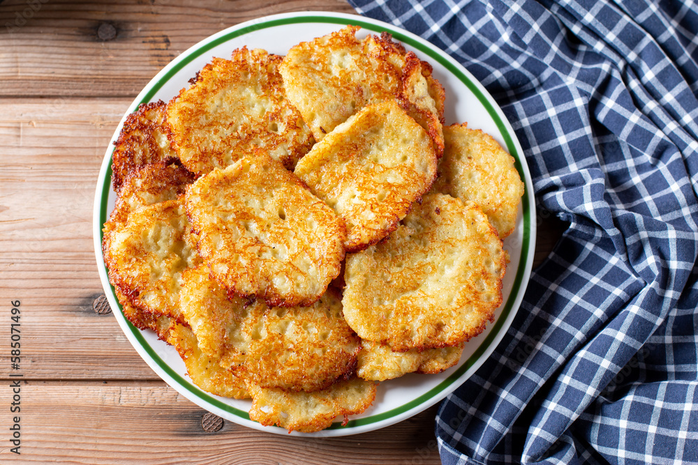 Potato pancakes. Stack of potato fritters. Top view Potato pancakes. Stack of potato fritters. Top view