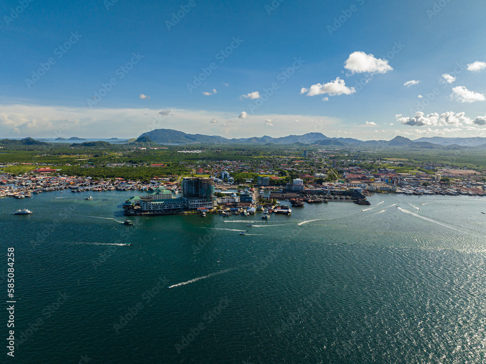 The town of Semporna with residential areas and a port. Borneo, Sabah, Malaysia.