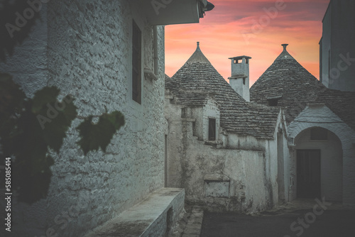 Trulli of Alberobello with sunset on the horizon - Bari - Italy