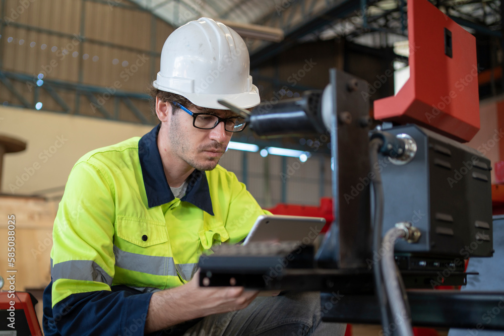 Engineers use tablet computer for machine maintenance, automation tools, robot arm at the factory. Engineers use tablet computer for machine maintenance, automation tools, robot arm at the factory.