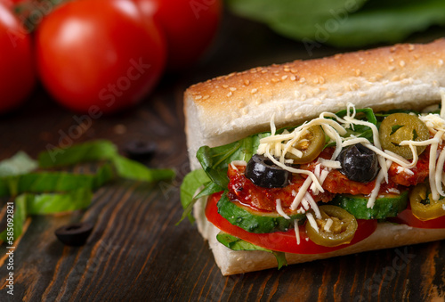 sandwich with olives and tomato, close up