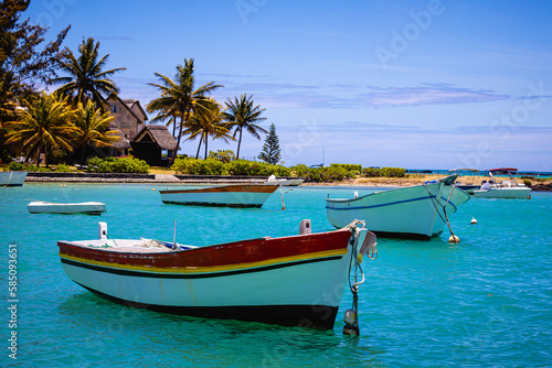 boat on the beach of mauritius with blue water © Reinhard