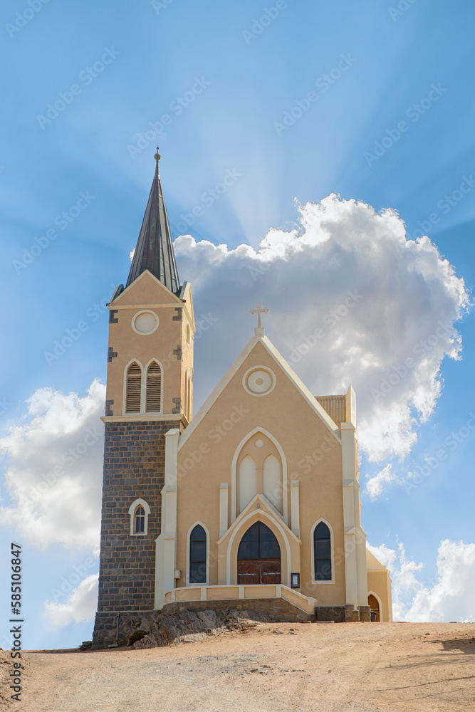 Famous German colonial church Felsenkirche on hill in desert town Luderitz - Namibia, Southern Africa