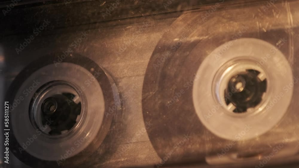 Audio cassette playback in vintage tape recorder. Record player playing