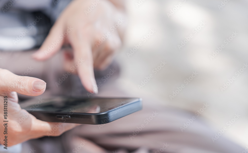 Women hand holding smartphone and finger touching on monitor for communication social online business