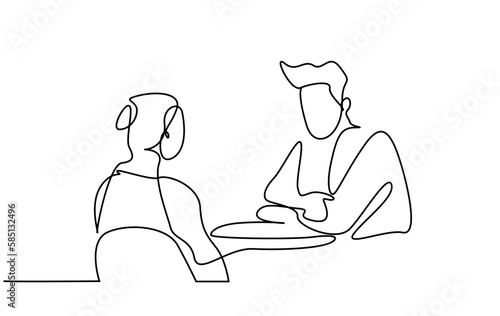 man and woman sitting down talking calmly having a meeting