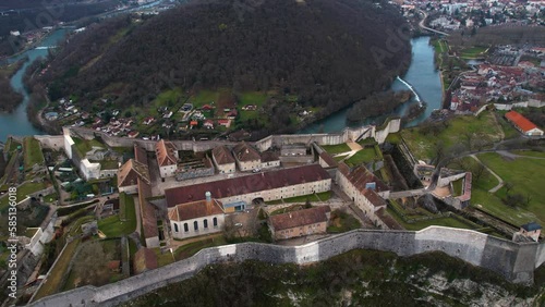 Aerial view of the old town of the city Besancon in France on a cloudy afternoon in early spring.