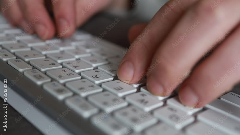 Close-up of male hands typing on keyboard indoors. Businessman working in office or student browsing information Close-up of male hands typing on keyboard indoors. Businessman working in office or student browsing information