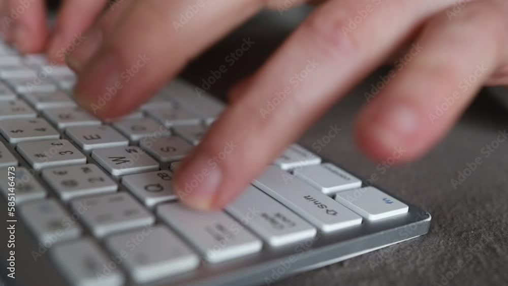 Close-up of male hands typing on keyboard indoors. Businessman working in office or student browsing information Close-up of male hands typing on keyboard indoors. Businessman working in office or student browsing information
