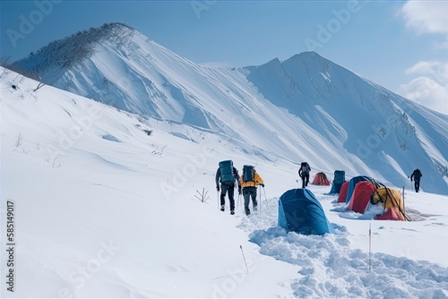 Group of mountain climbers climb the slope to the peak in sunny weather with sledges and tents equipment for overnight stays