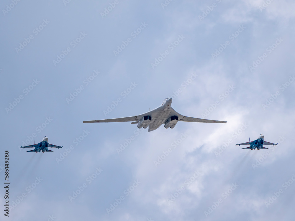 MOSCOW, RUSSIA - MAY 7, 2021: Avia parade in Moscow. su-35 and strategic bomber and missile platform Tu-160 in the sky on parade of Victory in World War II in Moscow, Russia